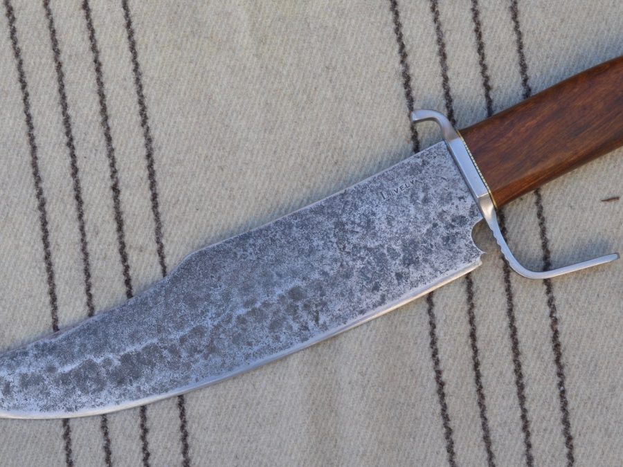 Hand forged bowie-style camp knife with wood handle and leather sheath